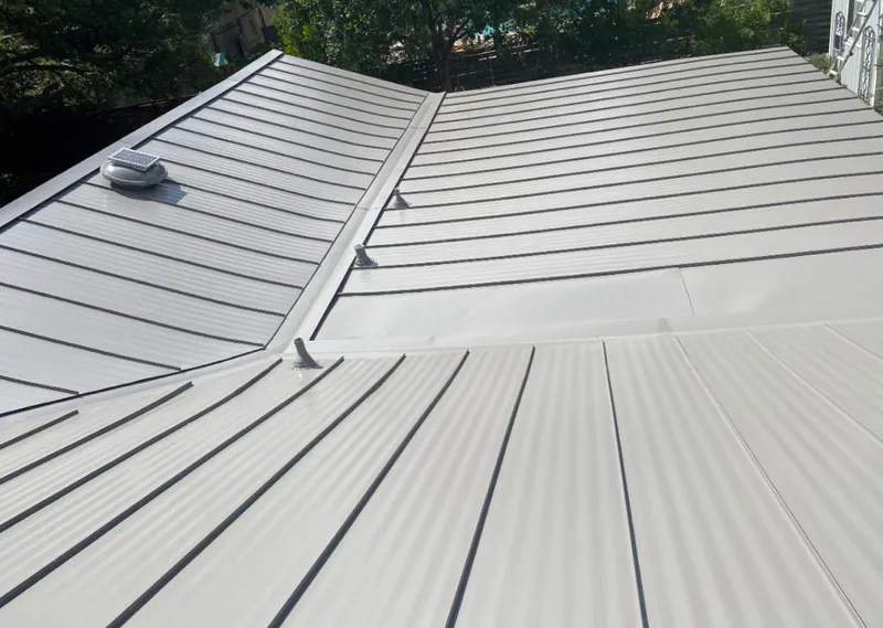 Solar attic fan installed on a metal roof for Roof Ventilation in Gibsonton